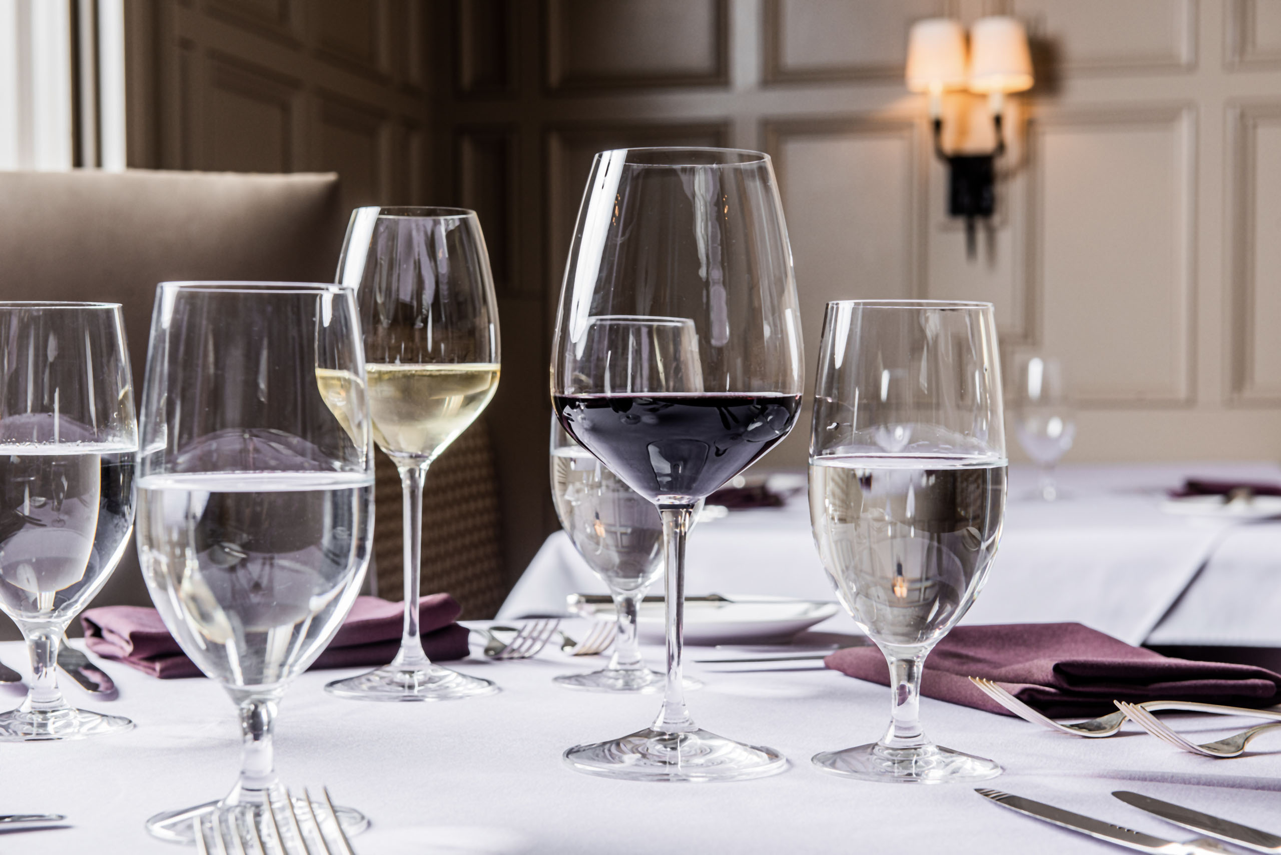 wine glasses on a dining table